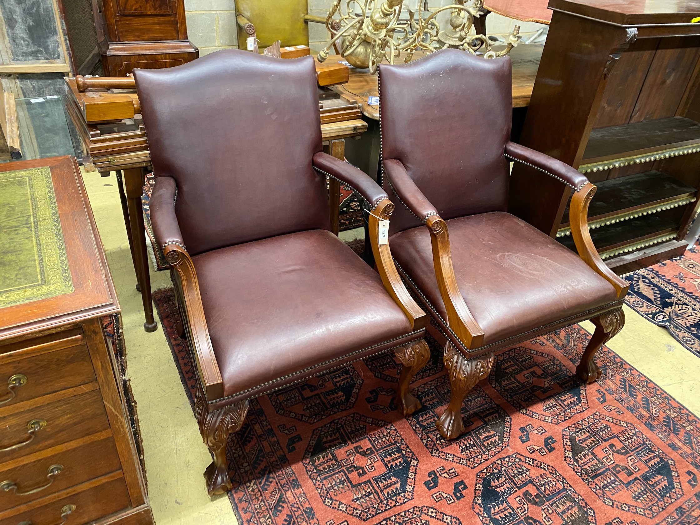 A pair of reproduction mahogany Gainsborough style library chairs, width 68cm, depth 70cm, height 100cm